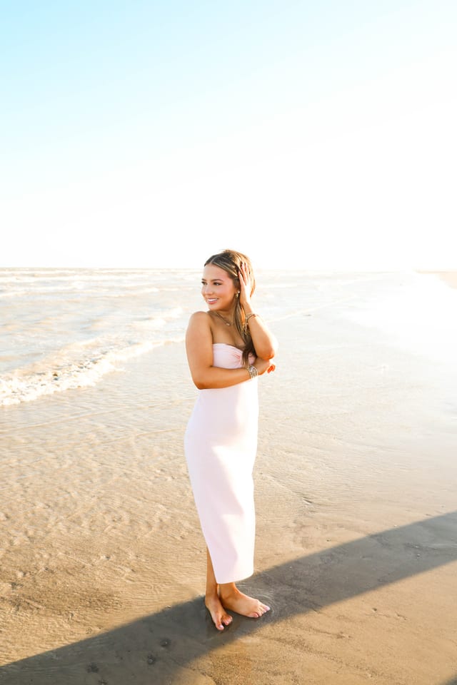 Pale pink dress on a sunlit beach
