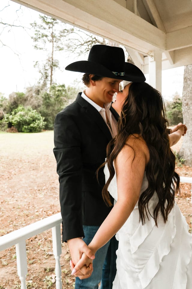Western-inspired couple under a gazebo
