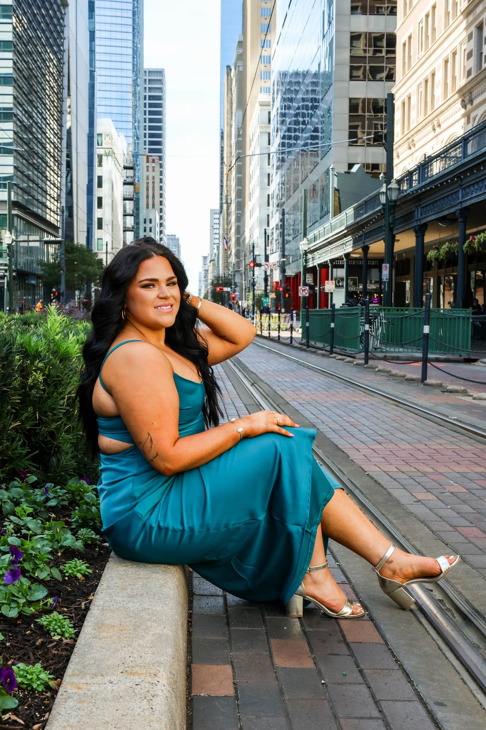 Senior in teal dress in downtown Houston