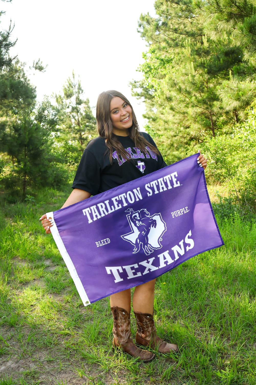 Senior with Tarleton State flag